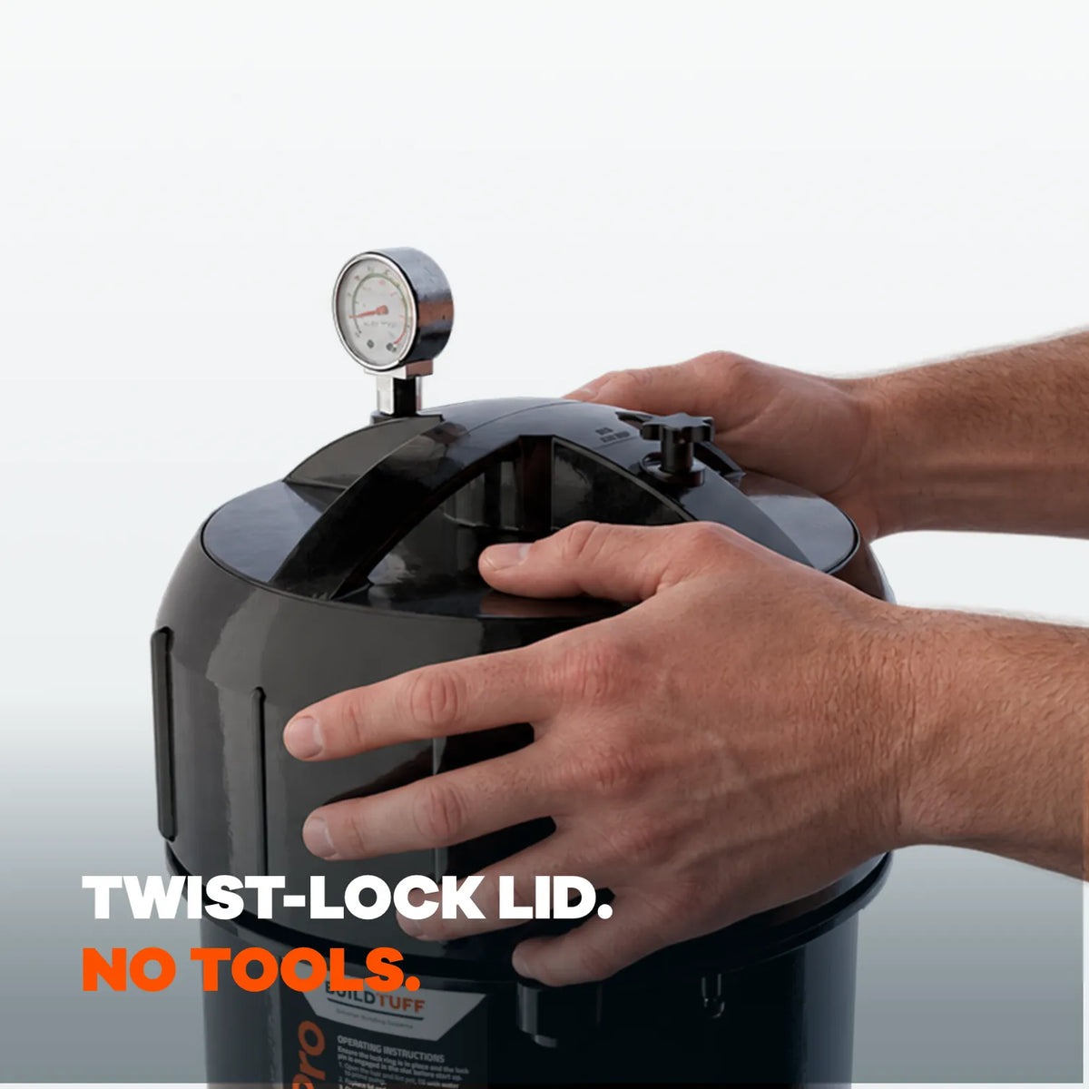 Hands twisting open the TuffFilter cartridge filter's twist-lock lid without tools