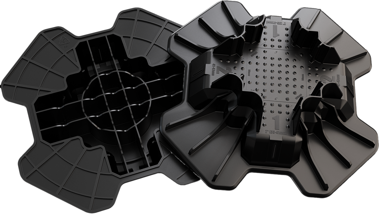 TuffBlock underside and topside, showing upright fins, dimples, grid ribs and clover feet